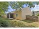 Backyard showcasing a covered patio and lush lawn at 310 Tuggle Court, Woodstock, GA 30188