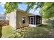 Charming backyard showcasing a covered patio and lush lawn at 310 Tuggle Court, Woodstock, GA 30188