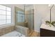 Bathroom with granite vanity countertop, tiled floor and glass shower enclosure at 310 Tuggle Court, Woodstock, GA 30188