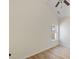 Bright bedroom featuring a window with green views and light wood flooring at 310 Tuggle Court, Woodstock, GA 30188