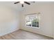 Vaulted bedroom featuring a large window with lush green views and light wood flooring at 310 Tuggle Court, Woodstock, GA 30188