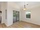 Bright dining area with sliding glass doors leading to an outdoor space, and a large window for natural light at 310 Tuggle Court, Woodstock, GA 30188