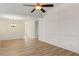 Spacious dining room area with wood floors, modern lighting, and ample natural light at 310 Tuggle Court, Woodstock, GA 30188