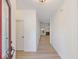 Welcoming entryway with light wood floors and a view of the living room and fireplace at 310 Tuggle Court, Woodstock, GA 30188