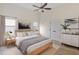 Serene main bedroom featuring neutral tones, ample natural light, and contemporary furnishings at 310 Tuggle Court, Woodstock, GA 30188