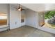 A covered, screened porch provides a sheltered outdoor living space with a ceiling fan and views of the backyard at 310 Tuggle Court, Woodstock, GA 30188
