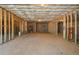 Expansive unfinished basement with exposed ceiling at 564 Grand Ashbury Ln, Sugar Hill, GA 30518