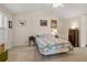 Bedroom featuring a large window, neutral walls and a traditional dresser at 564 Grand Ashbury Ln, Sugar Hill, GA 30518