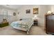 Bedroom with large window and quilted comforter at 564 Grand Ashbury Ln, Sugar Hill, GA 30518