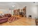 Spacious living room featuring vaulted ceilings, hardwood floors, and cozy furniture for a comfortable gathering space at 564 Grand Ashbury Ln, Sugar Hill, GA 30518