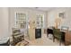 Comfortable office with two windows, traditional furnishings, and ample natural light at 564 Grand Ashbury Ln, Sugar Hill, GA 30518
