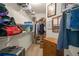 Walk-in closet with wire shelving, ample storage space and bonus chest of drawers at 564 Grand Ashbury Ln, Sugar Hill, GA 30518