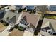 Aerial view showcases the home's location, roof, and landscaping within a residential neighborhood at 1295 Leisure Lake Dr, Lawrenceville, GA 30044