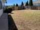 View of a spacious, grassy backyard with a wooden fence, perfect for outdoor activities and relaxation at 1295 Leisure Lake Dr, Lawrenceville, GA 30044