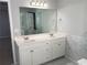 Elegant bathroom with dual sinks, marble accents, and a glass shower at 1295 Leisure Lake Dr, Lawrenceville, GA 30044