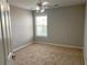 Clean bedroom with neutral colors, plush carpet, and natural light at 1295 Leisure Lake Dr, Lawrenceville, GA 30044