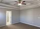 Bright bedroom with neutral walls, plush carpet, and modern ceiling fan at 1295 Leisure Lake Dr, Lawrenceville, GA 30044