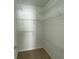 Spacious walk-in closet with multiple shelves for ample storage and organization at 1295 Leisure Lake Dr, Lawrenceville, GA 30044