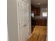 A view of the kitchen featuring wood cabinets, stainless steel appliances, granite countertops, and hardwood floors at 1295 Leisure Lake Dr, Lawrenceville, GA 30044