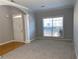 Bright living area with large windows and an arched entryway at 1295 Leisure Lake Dr, Lawrenceville, GA 30044