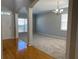 Bright living area with large windows, columns, and hardwood floors at 1295 Leisure Lake Dr, Lawrenceville, GA 30044