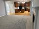 Open living area featuring a fireplace with views of the kitchen and hardwood floors at 1295 Leisure Lake Dr, Lawrenceville, GA 30044