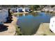 Aerial view of the pond provides a serene backdrop and enhances the community's natural charm at 1295 Leisure Lake Dr, Lawrenceville, GA 30044
