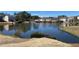 Scenic view capturing the pond with neighborhood homes in the background, highlighting the community's natural charm at 1295 Leisure Lake Dr, Lawrenceville, GA 30044
