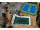 Aerial shot features community tennis courts and pool in a desirable neighborhood at 1295 Leisure Lake Dr, Lawrenceville, GA 30044