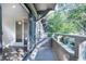 Balcony view with sliding glass doors leading to a bright room and view of the surrounding trees at 1303 Highland Bluff Se Dr # 303, Atlanta, GA 30339