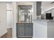 Charming bar area with granite countertop, glass shelves, and stylish lighting, ideal for entertaining guests at 1303 Highland Bluff Se Dr # 303, Atlanta, GA 30339
