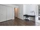 Bedroom with a workspace and a double closet, showcasing modern fixtures and ample storage at 1303 Highland Bluff Se Dr # 303, Atlanta, GA 30339