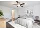 Bright, airy bedroom with neutral decor, modern ceiling fan, and comfortable furnishings at 1303 Highland Bluff Se Dr # 303, Atlanta, GA 30339