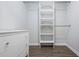 Walk-in closet with a dresser and shelving unit at 1303 Highland Bluff Se Dr # 303, Atlanta, GA 30339