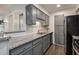 A bright kitchen with subway tile backsplash, granite countertops, and stainless steel appliances at 1303 Highland Bluff Se Dr # 303, Atlanta, GA 30339