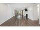 Spacious living room featuring a fireplace, tv, hardwood floors, and balcony access at 1303 Highland Bluff Se Dr # 303, Atlanta, GA 30339