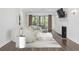 Bright living room with fireplace, hardwood floors and modern furnishings at 1303 Highland Bluff Se Dr # 303, Atlanta, GA 30339