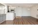 Open concept living space with wood flooring and a view of the kitchen area at 1303 Highland Bluff Se Dr # 303, Atlanta, GA 30339