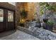 Beautiful stone lobby with waterfall feature and decorative plants near the entrance doors at 1303 Highland Bluff Se Dr # 303, Atlanta, GA 30339