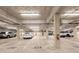 Well-lit parking garage featuring assigned parking spaces and storage lockers at 1303 Highland Bluff Se Dr # 303, Atlanta, GA 30339