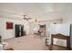 Finished basement with multiple ceiling fans, a basketball game, and a vintage-style refrigerator at 30 Apache Ct, Locust Grove, GA 30248