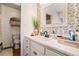 Charming bathroom featuring decorative wallpaper, a single sink vanity, and stylish decor accents at 30 Apache Ct, Locust Grove, GA 30248