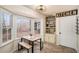 Sunlit breakfast nook with built-in shelving, views of the backyard, and a cozy spot for casual dining at 30 Apache Ct, Locust Grove, GA 30248