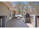 Outdoor deck featuring lounge furniture, a grill, and scenic views of the surrounding trees and natural landscape at 30 Apache Ct, Locust Grove, GA 30248