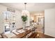 Bright dining area with farmhouse table and access to the outdoor deck and kitchen at 30 Apache Ct, Locust Grove, GA 30248