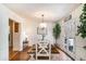 Elegant dining room featuring a farmhouse table with seating and outdoor access at 30 Apache Ct, Locust Grove, GA 30248