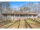 Ranch home with stone accents, shutters, and cozy front porch on a large lot at 30 Apache Ct, Locust Grove, GA 30248