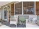 Inviting front porch with seating and charming decor at 30 Apache Ct, Locust Grove, GA 30248
