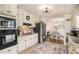 Updated kitchen boasts modern appliances, granite countertops, ample cabinet space, and adjacent dining area at 30 Apache Ct, Locust Grove, GA 30248