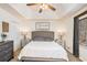 Relaxing main bedroom with tray ceilings, neutral tones, and ample natural light. A peaceful retreat at 30 Apache Ct, Locust Grove, GA 30248